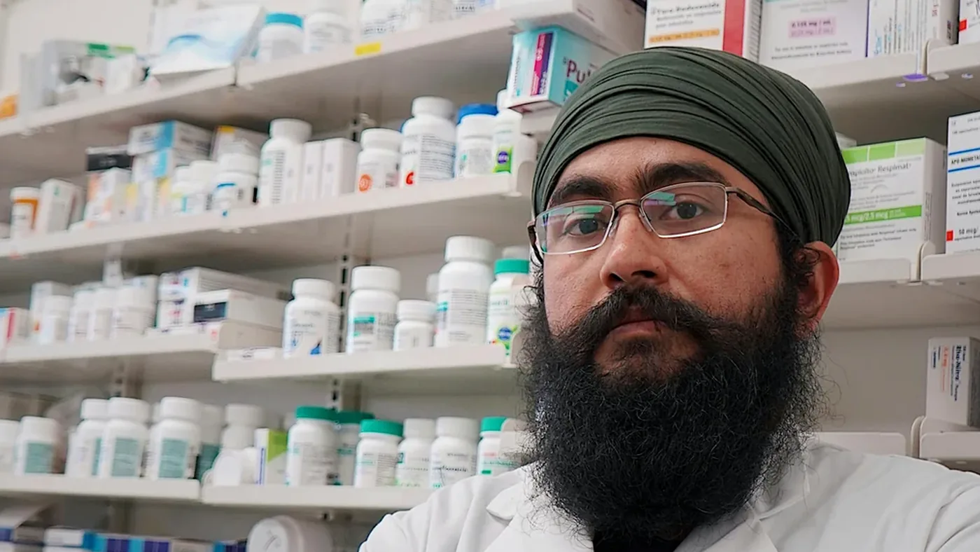 Pharmacist explaining controlled substance prescription regulations to patient